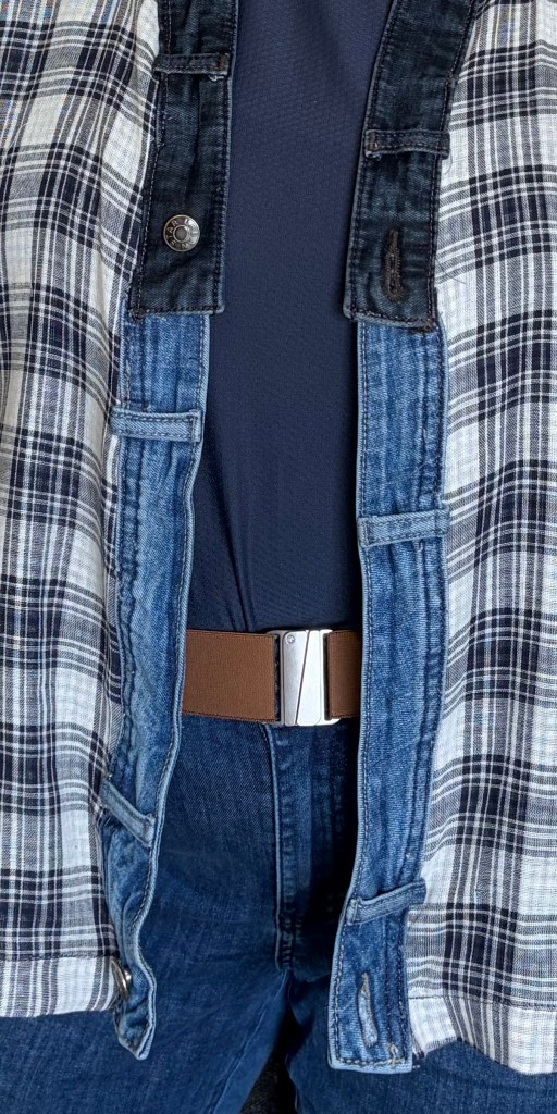the front of a gauze jacket that has upcycled denim waistbands as the front band